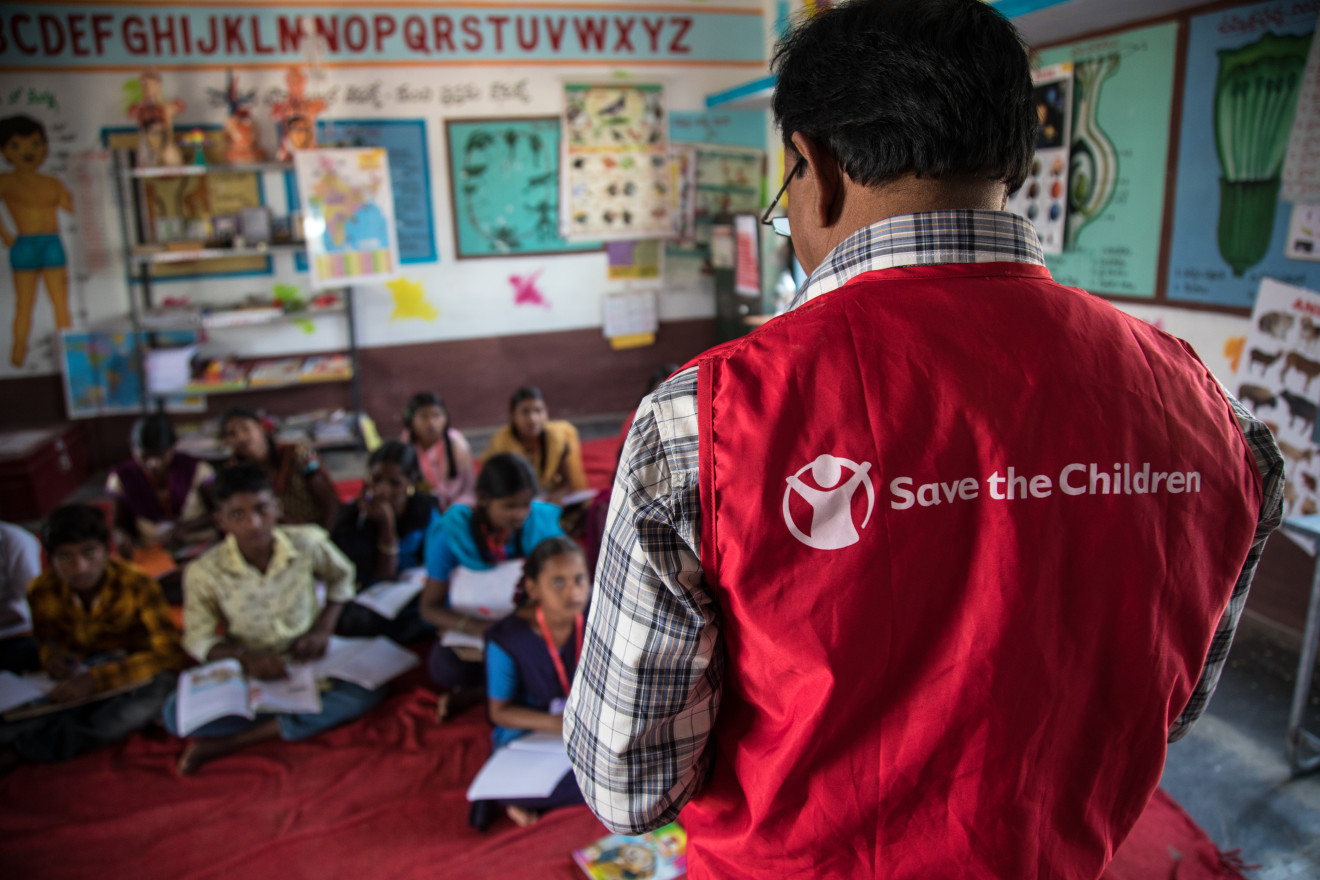 A teacher from Save the Children in a class room.